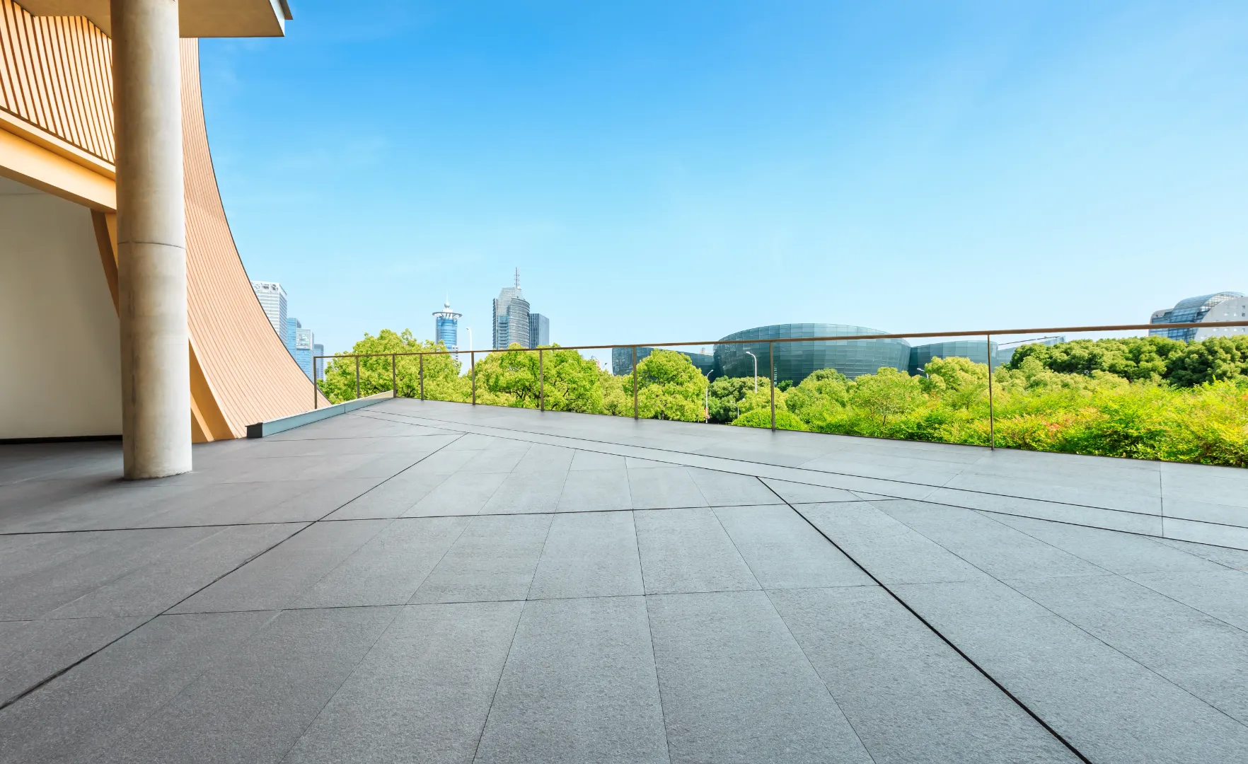 Aluminum decking on a modern outdoor terrace overlooking a city landscape